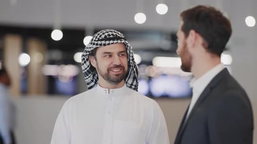 Two Men Talking in Bright Modern Office