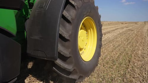 Harvester Drives Across Field and Harvests Crop Harvest Concept