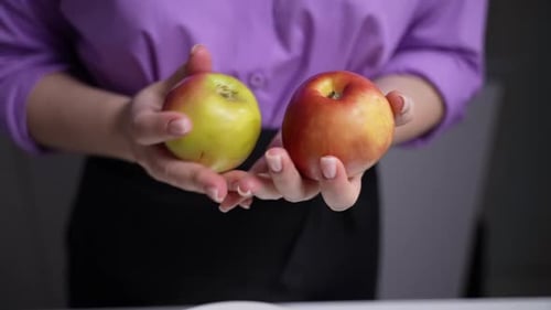 Woman Holding Apples in Hands Closeup