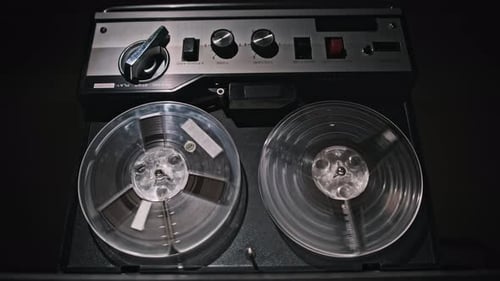Vintage Reel-to-Reel Tape Recorder Playing Music