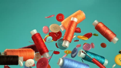 Sewing notions and multicolored buttons floating up on blue