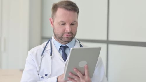 Doctor Using Tablet for Medical Work