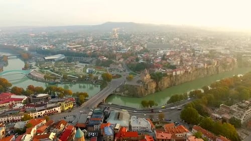 Sweeping Aerial View of Cityscape with River Bridges