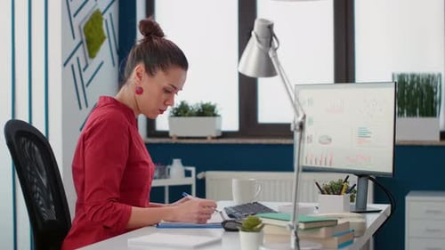 Businesswoman Working at Computer in Modern Office