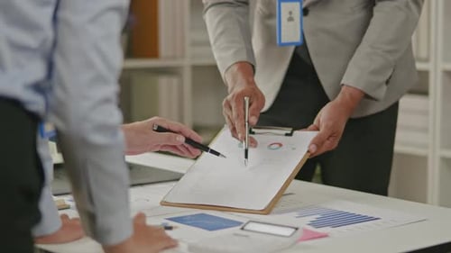 Close up of business hands are working and brainstorming on paperworks.
