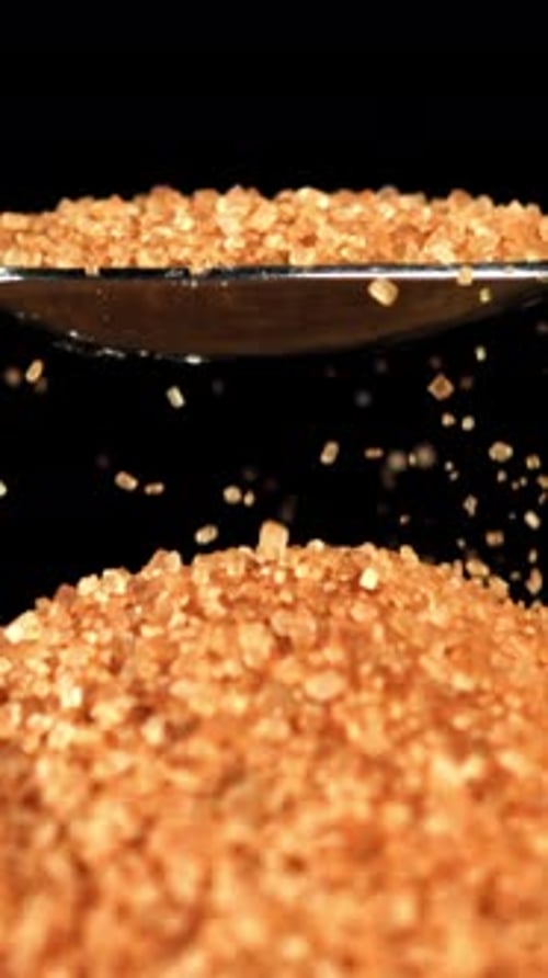 Cane Sugar Pours Out of a Spoon Filmed on a Highspeed Camera at 1000 Fps