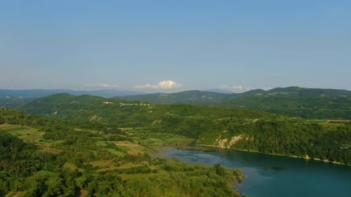 Lake Butoniga water dam in Croatia left pan revealing nearby hills, Aerial drone left pan reveal sho