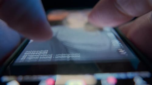 Fingers Scroll Through Social Media Feed on Phone