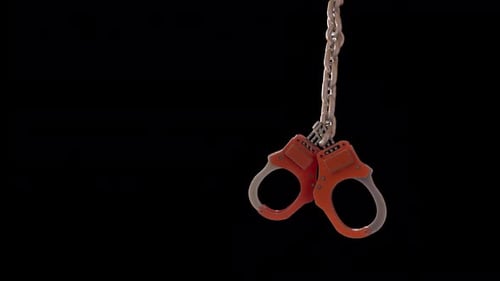 Animated Handcuffs on a Chain Swaying in a Loop