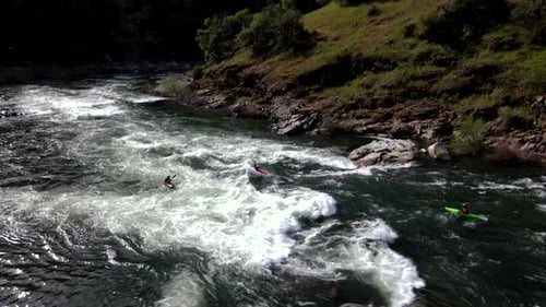 Drone Footage of People Kayaking in rapids in Mountain River