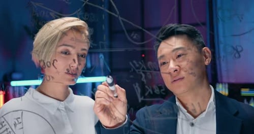 Two Colleagues Brainstorming Science on Transparent Screen