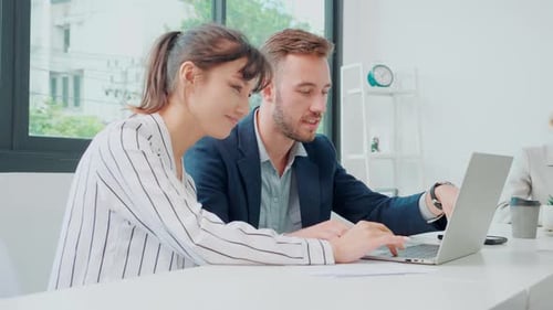 Young caucasian businessman is entrepreneur training businesswoman working confident together.