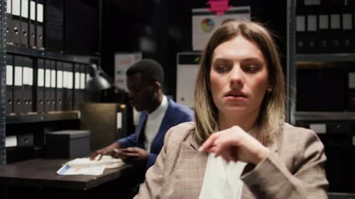 Frustrated Colleagues Arguing in the Dark Office