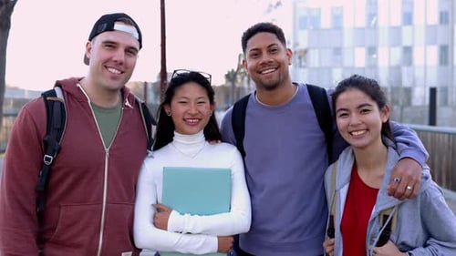 Multiracial Group of United College Student Friends Smiling at Camera Outdoors