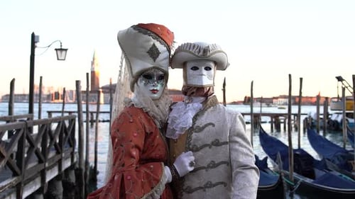 Venetian Carnival Couple Posing on Dock During Daytime
