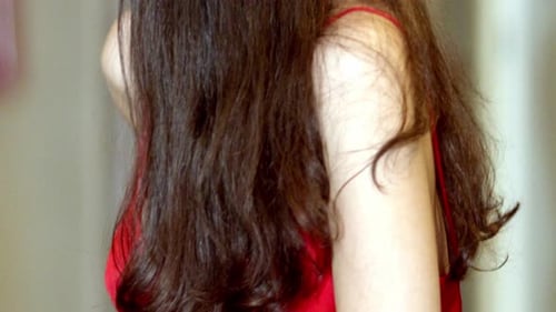 Young Woman in Red Dress with Jeweled Headband