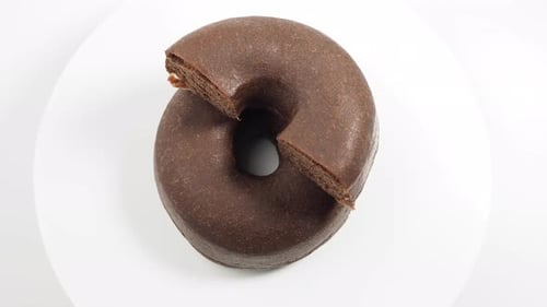 Chocolate Donut with Piece Missing Close Up