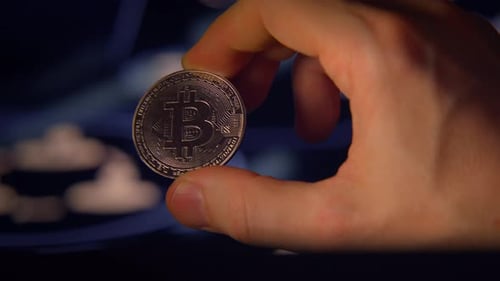 Hand Holding Bitcoin Cryptocurrency Coin