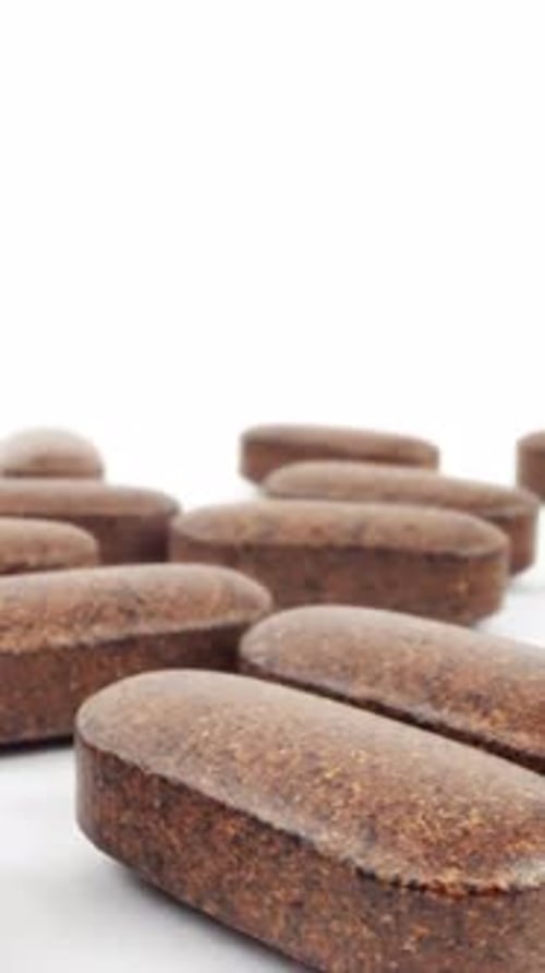 Close Up of Brown Dietary Supplement Pills