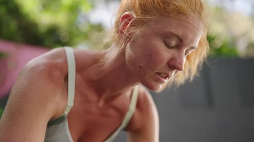 Redhead Woman Performs Pushups in Tropical Gym Shows Fitness Power Strong Female Trains Arms Core in