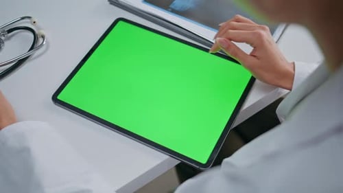 Doctor Touching Greenscreen Tablet in Clinic Office Closeup Woman Therapist