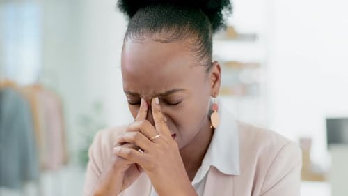 Woman Closes Eyes, Fingers on Brow and Nose