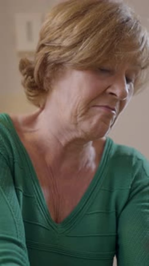 An Old Widow Spanish Woman Is Preparing A Christmas Tree For Holiday Season Close Up