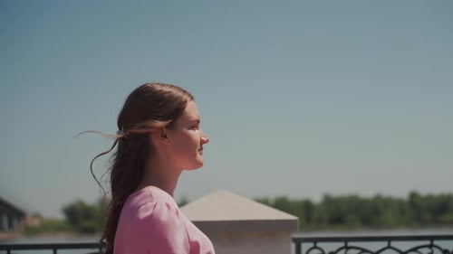 River Scene Serene Thoughtful Woman Standing Beside Flowing River at Sunset Pensive Woman with