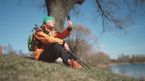 Good Sunny Weather in Park Elderly Lady Taking Selfie By Mobile Phone Outdoors Happy Retirement and