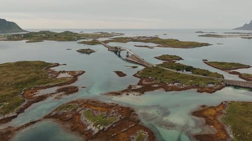 In Stunning Detail a Drone's Aerial View Showcases a Lone Boat Traversing the Ocean While Surrounded