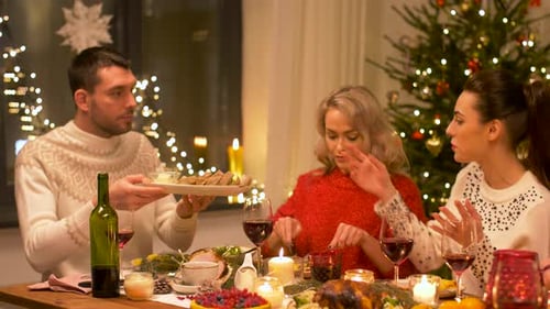 Friends Enjoying Christmas Dinner at Home