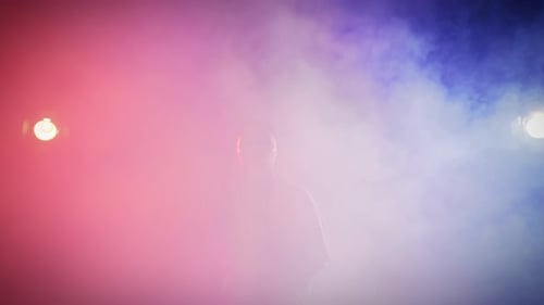 Portrait of Lonely Frustrated Woman Standing Alone in Smoke Red and Blue Lights Young Lady Looking