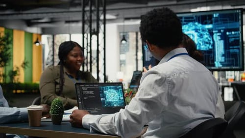 Data Scientists in Startup Office Brainstorming Leveraging AI Tech