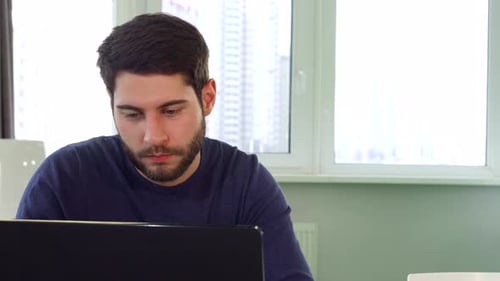 Focused Architect Enjoying a Welldeserved Break at the Office