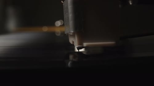 Record Player Needle on Black Vinyl Record