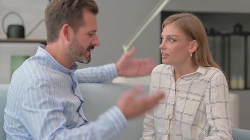 Young Man Fighting with Wife at Home