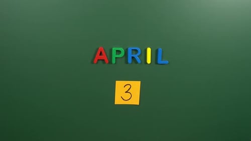Hand sticking a sticker 3 April calendar day on school board. 3 date of April. Third day April