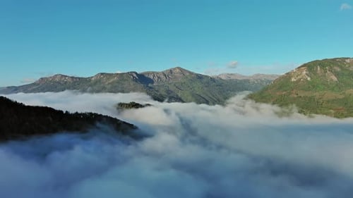 Aerial View of Clouds and Mountains at Sunrise