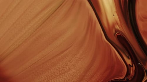 Abstract Viscous Liquid Swirling in Golden Brown Tones