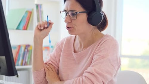 Teacher Leading Online Lesson in Classroom