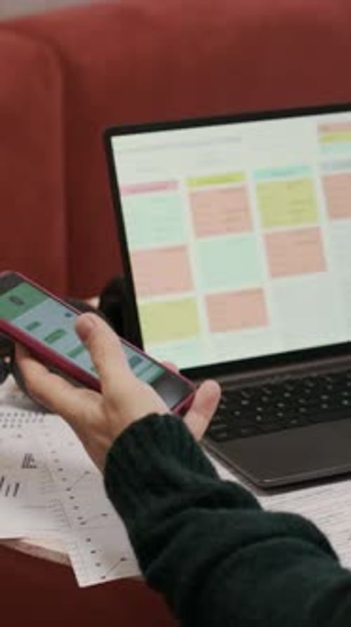 Office Worker Checking Smartphone Notifications