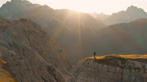 Bride and Groom Stand Near Chasm in Tre Cime Di Lavaredo