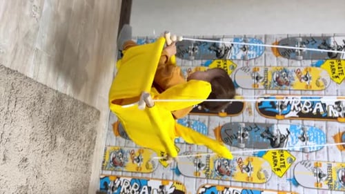 Smiling Infant Swinging Happily in a Cloth Swing