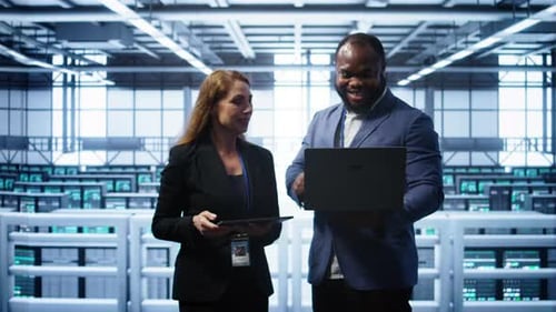 Admin Greeting Inspector Arriving in Data Center to Supervise Operations