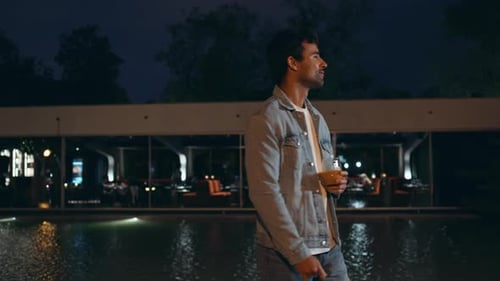 Latin Man Chilling Night Walk Near Water Pool Relaxed Guy Holding Glass Alcohol