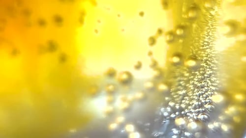 Macro Abstract Yellow Bubbles Sparkling Blobs into Colorful Bright Golden Fluid, Creative Background