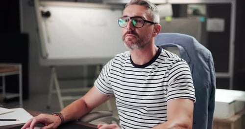 Man with Grey Hair Working in the Office