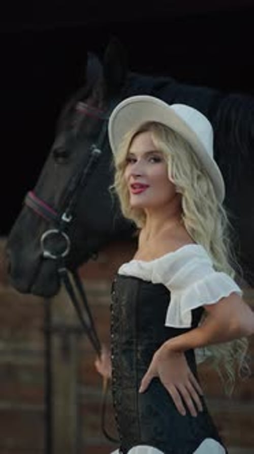 Beautiful Woman with Horse in Cowgirl Outfit