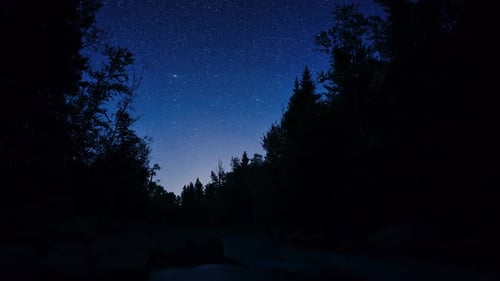 Night timelapse over a river in Canada.