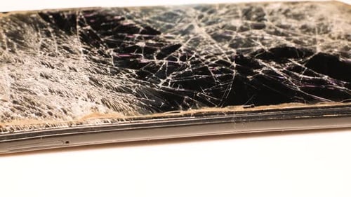 Shattered Smartphone Screen Displaying Cracks